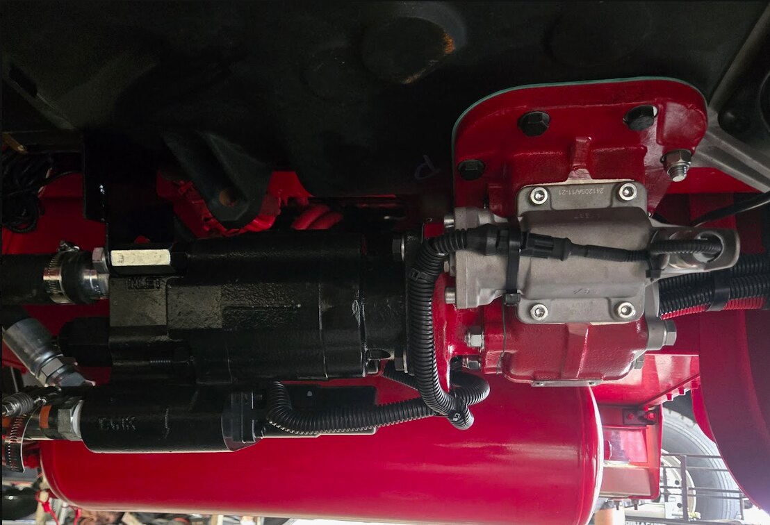 PTO and pump components installed beneath a truck