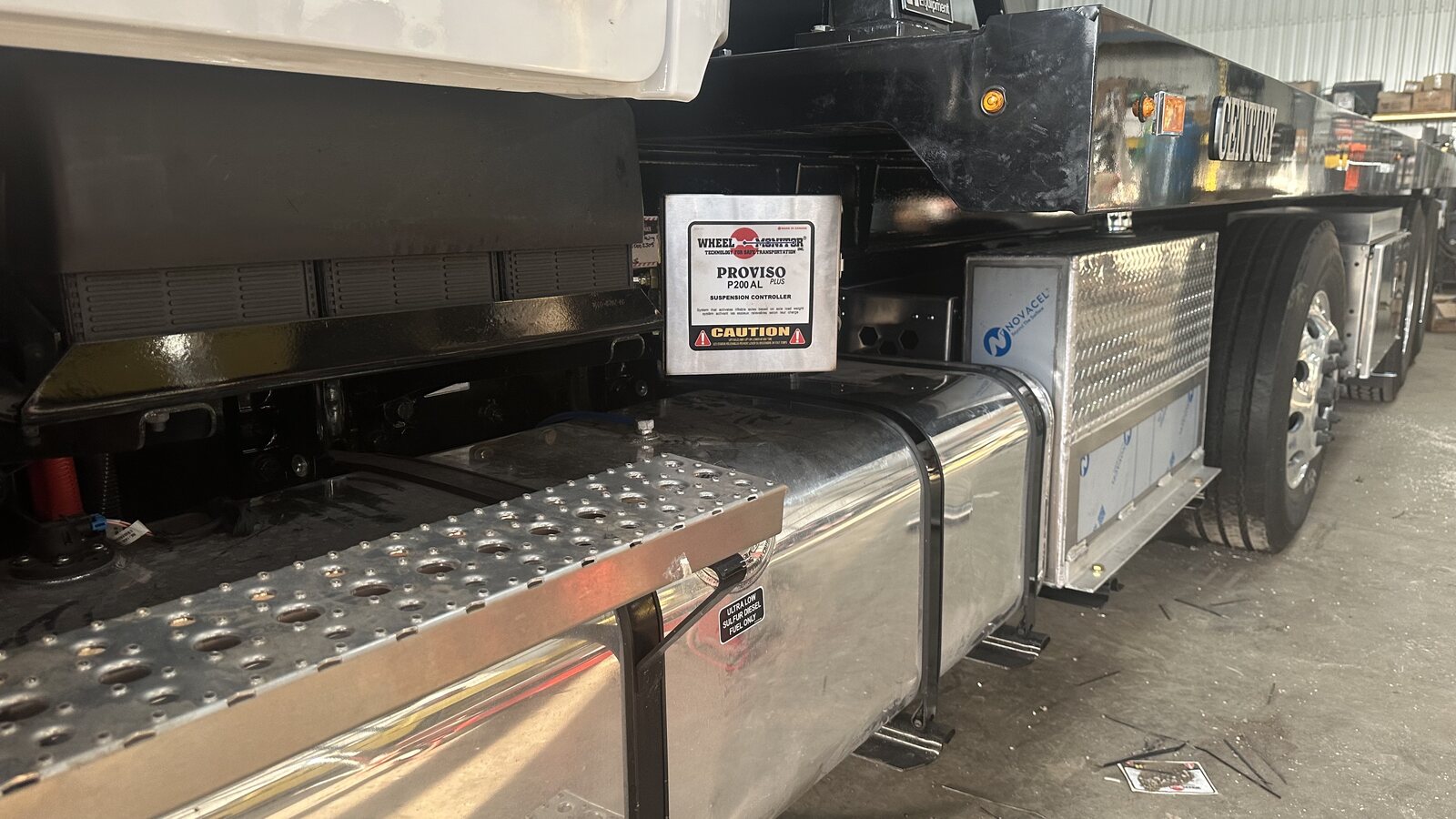 SPIF suspension control equipment installed behind the cab of a work truck